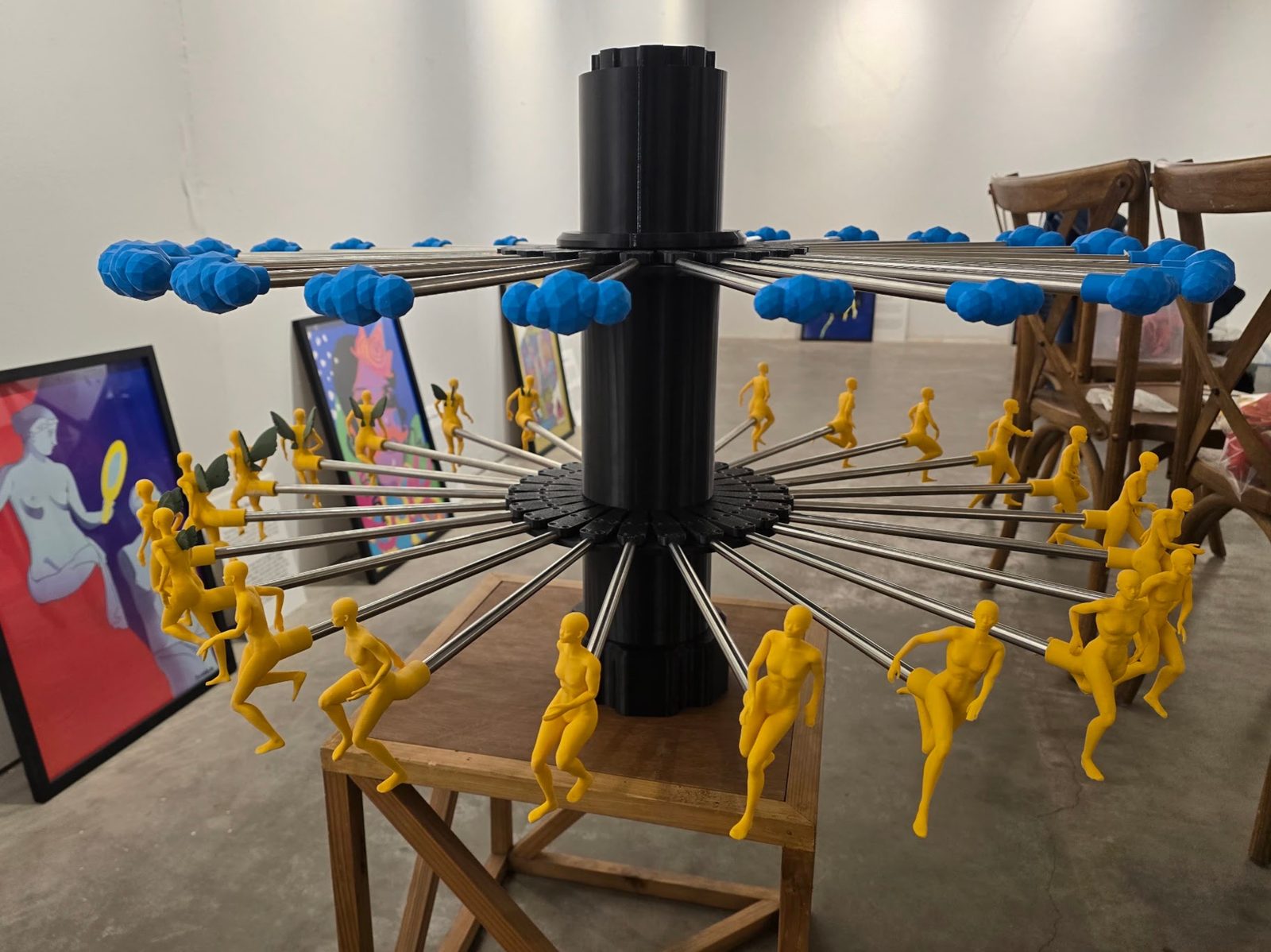 The centre tower lifted out of the machine and stood on a table, carrying the human-form ring below and the cloud ring above, all 48 radial spokes fitted