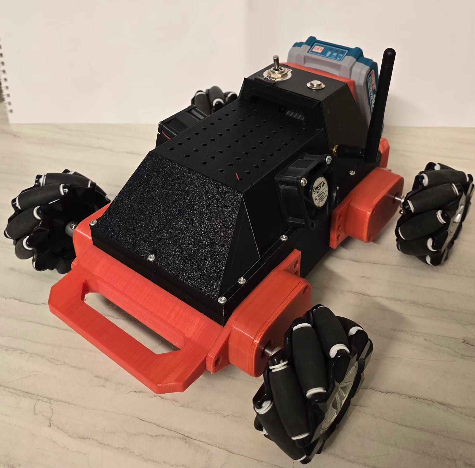 The finished chassis — mecanum wheels, 3D-printed PETG frame, ESP32 stack